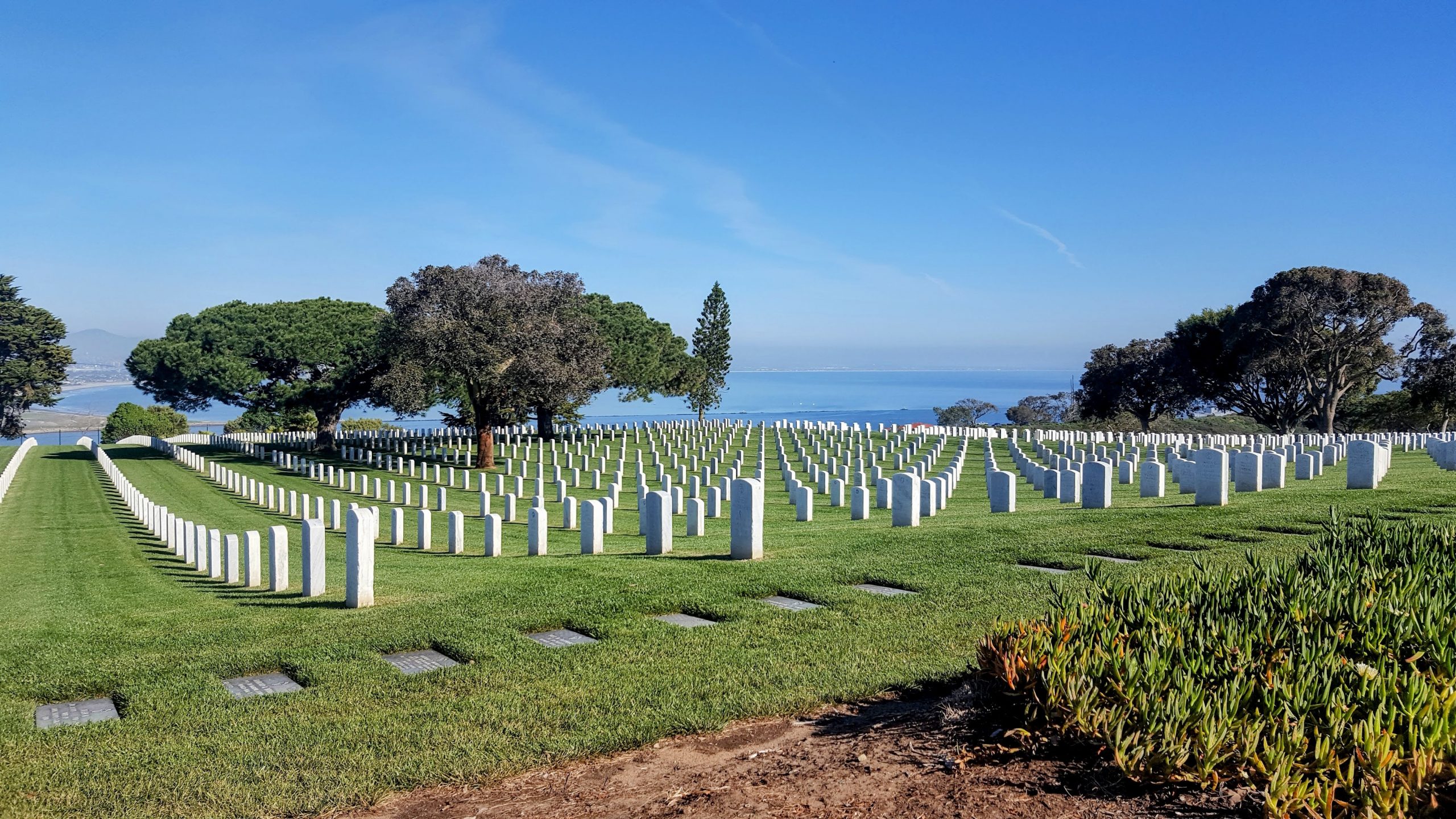 National cemetery overlooking the ocean, representing the cost of freedom and the meaning of Memorial Day