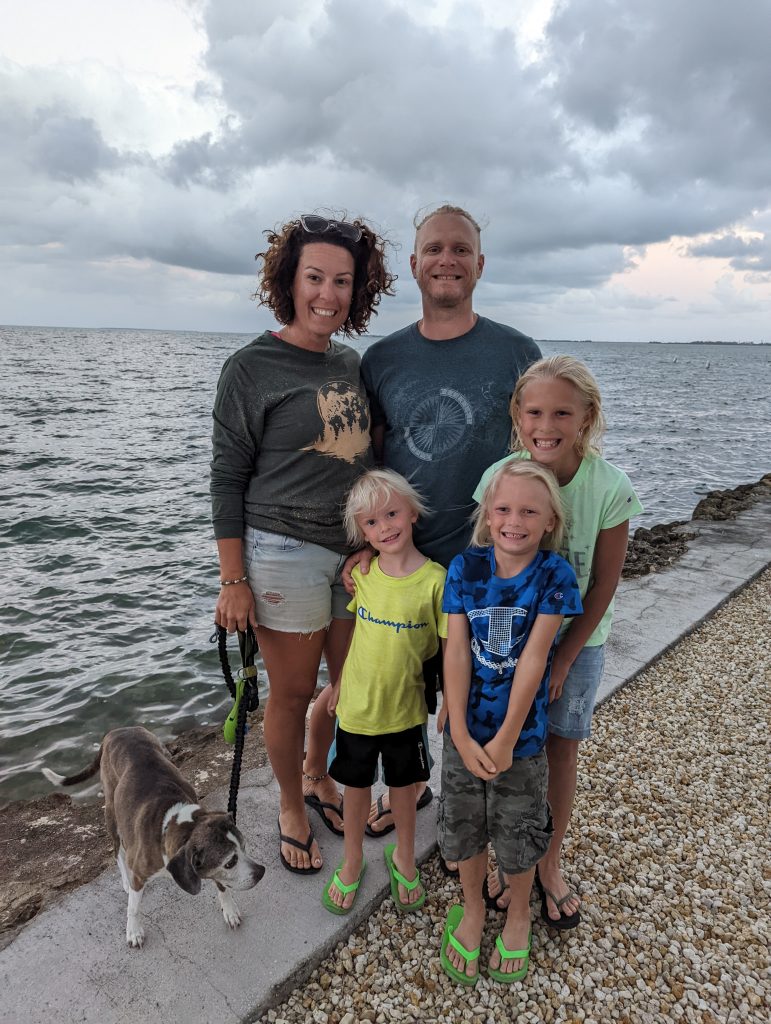 Full-time RV family practicing natural sun protection without sunscreen while enjoying outdoor life by the water
